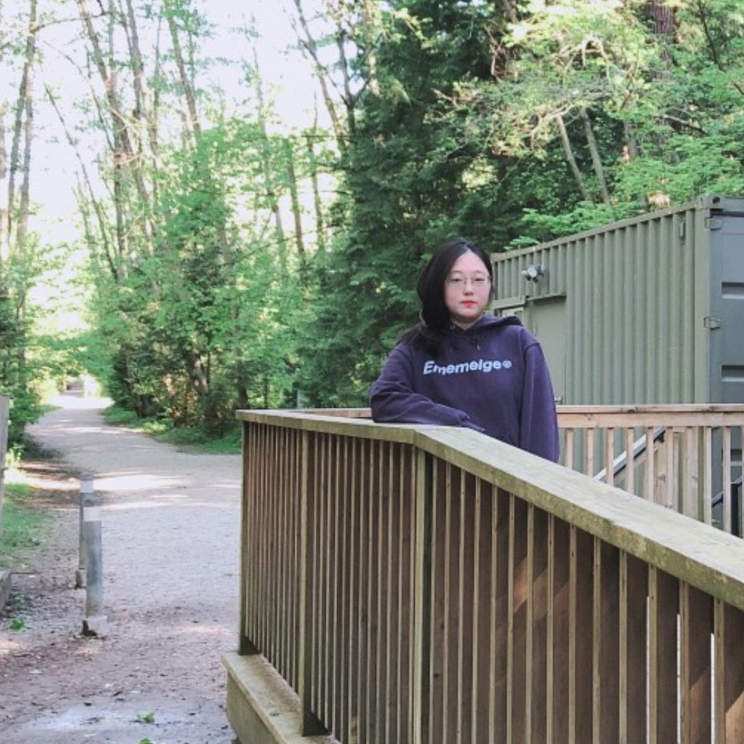 Jenny Lee posing at the Pacific Spirit Regional Park Hiking Centre
